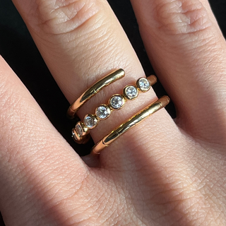 Gold and Diamond Spiral Ring on finger